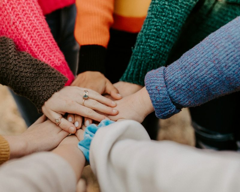 Group of hands together in support, eviction prevention