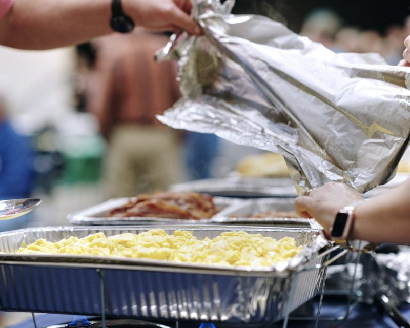 Volunteers serving a community meal